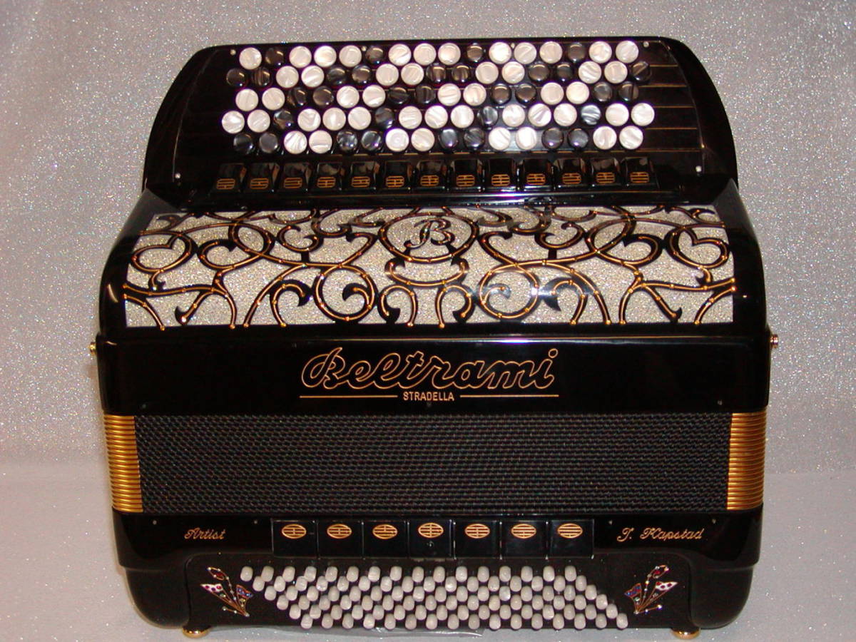 A professional quality 3-voice treble, 96 bass, 43 treble-button instrument with hand made "a mano" reeds one set of which are in the cassotto tone chamber. Available in a full range of colours. Model shown is with personalised gold finishing and differs slightly from the specification in the number of treble reeds and registers.